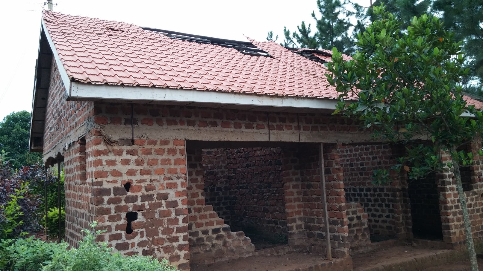 Storm damage on the Seya house roof, 2015.