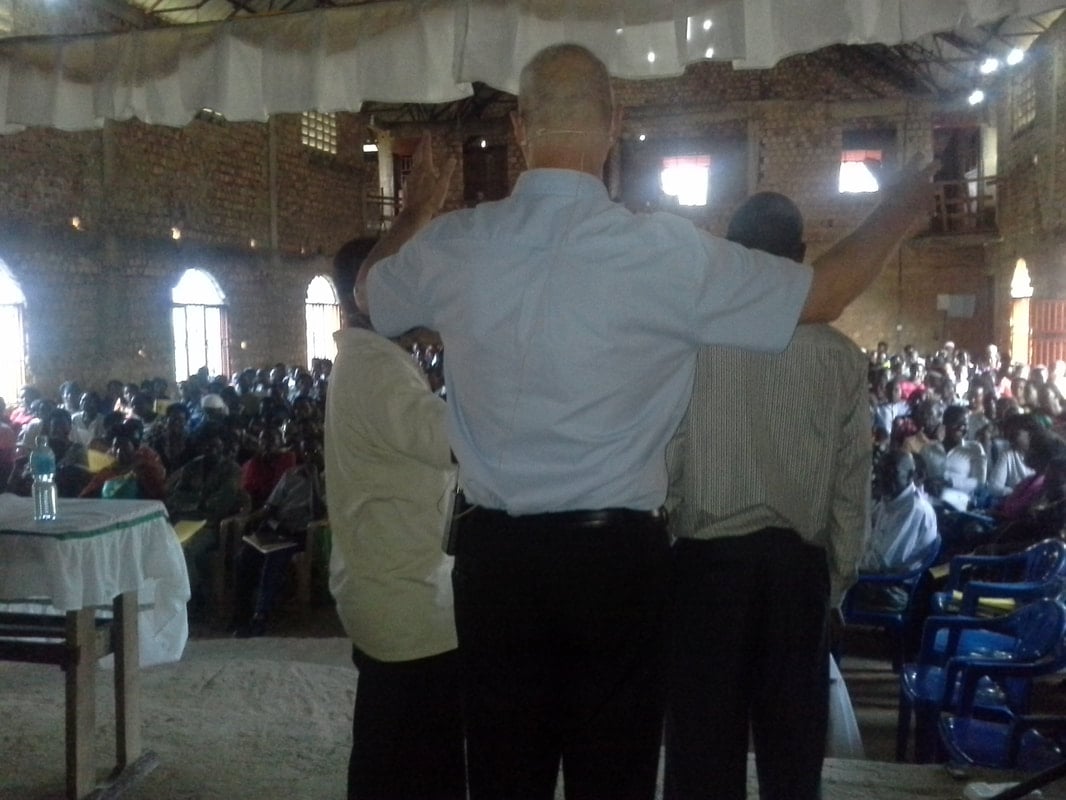 Leaders with arms raised at Zion, 2017.
