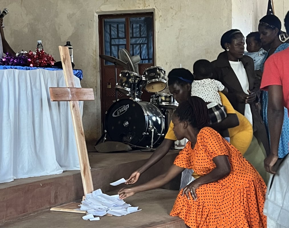 Prayer at a Uganda symposium, 2019.