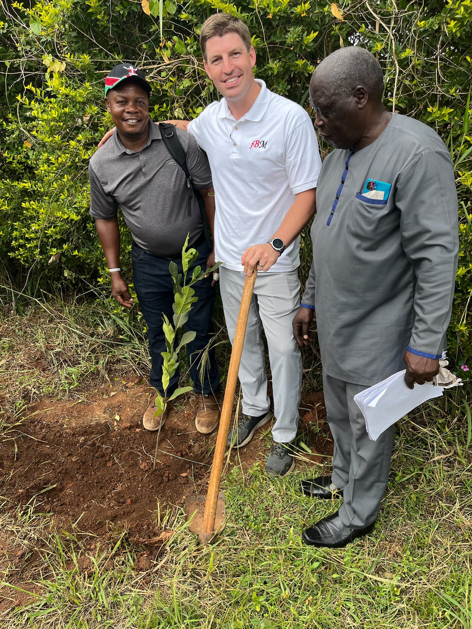 Mark and Pastor David with a sapling, 2024.
