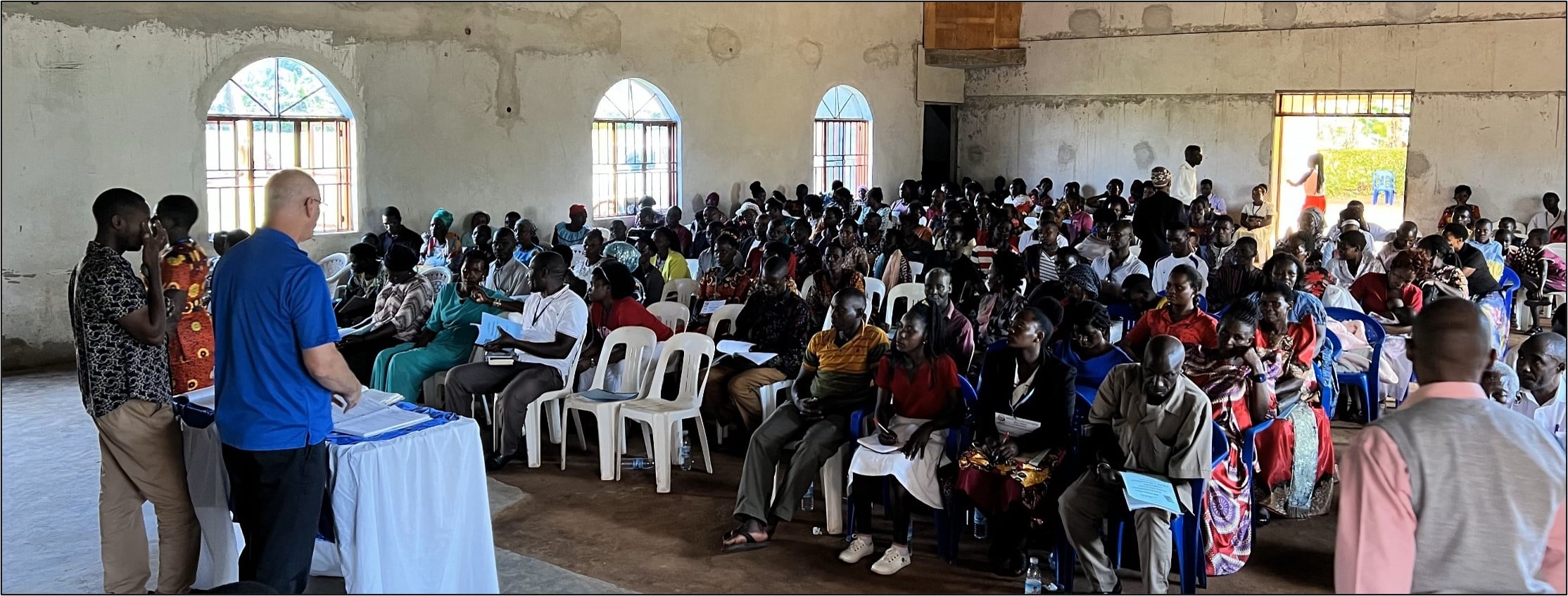 Mark teaching a packed hall at Zion, 2024.
