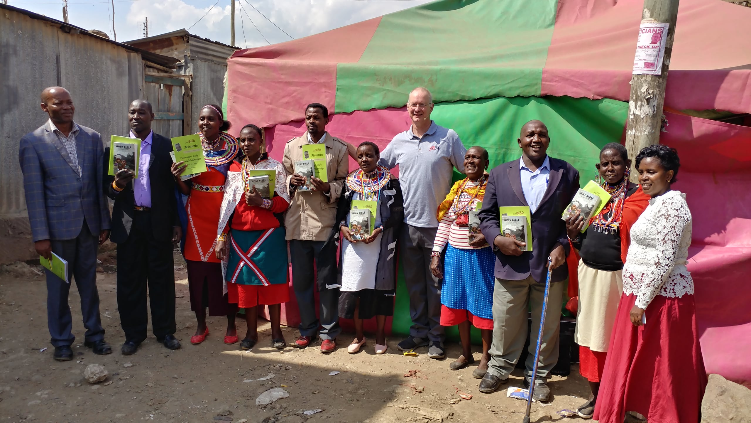 Mark and Pastor Maurice with Bibles, 2019.