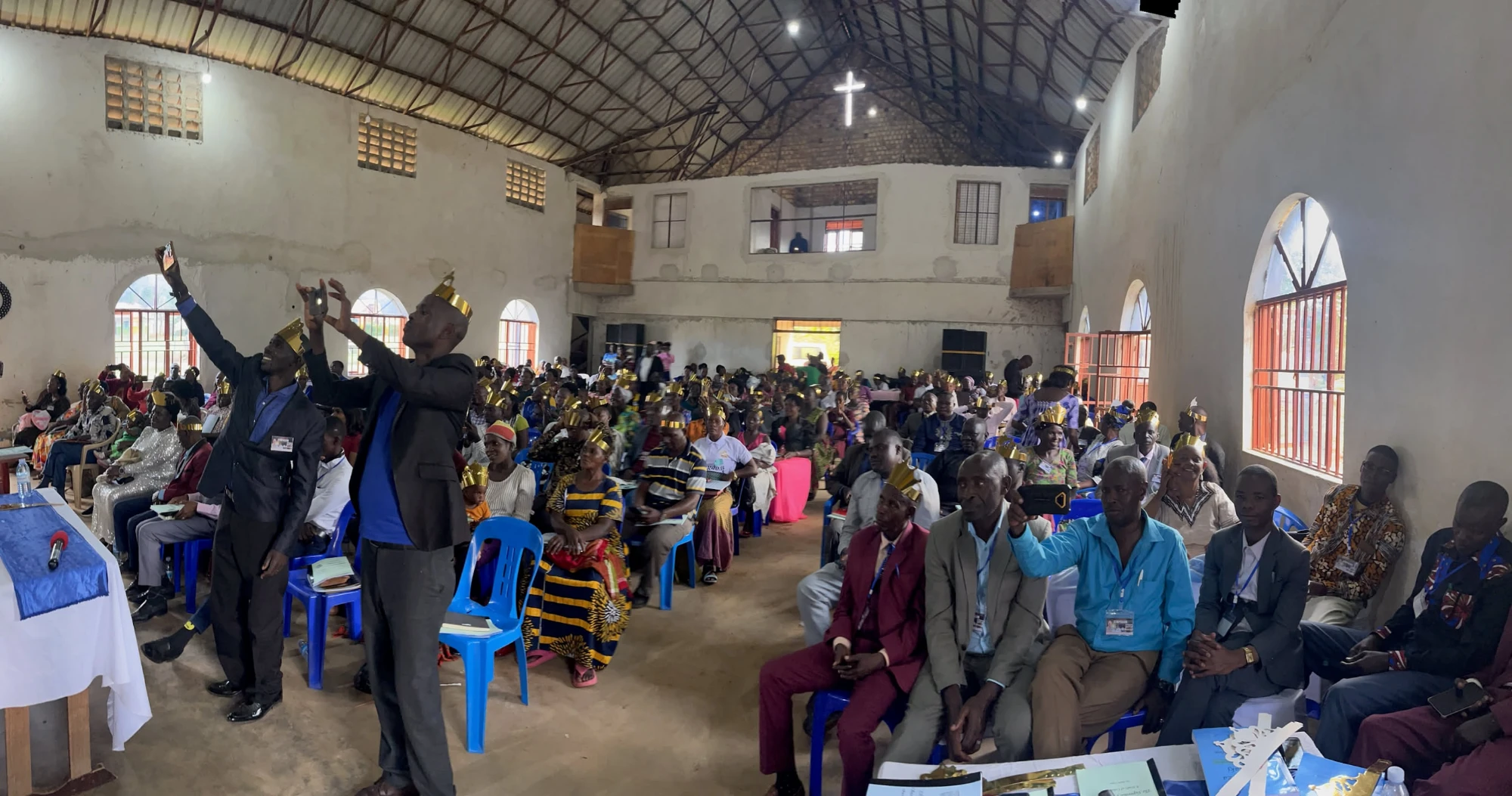 Hundreds worship with lifted hands at the 9th Symposium.